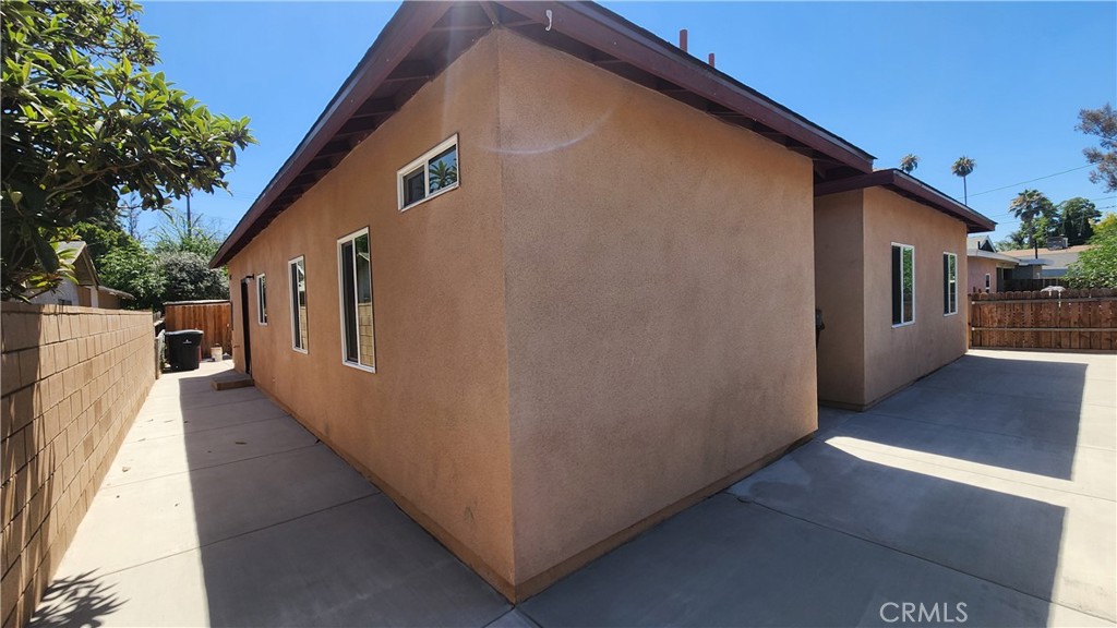 3433 Eucalyptus Avenue Riverside, CA 92507 - Photo 6 of 38 a backyard of a house with wooden floor and outdoor seating