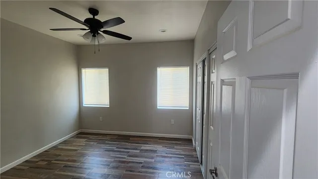a bathroom with a granite countertop sink toilet a mirror and shower