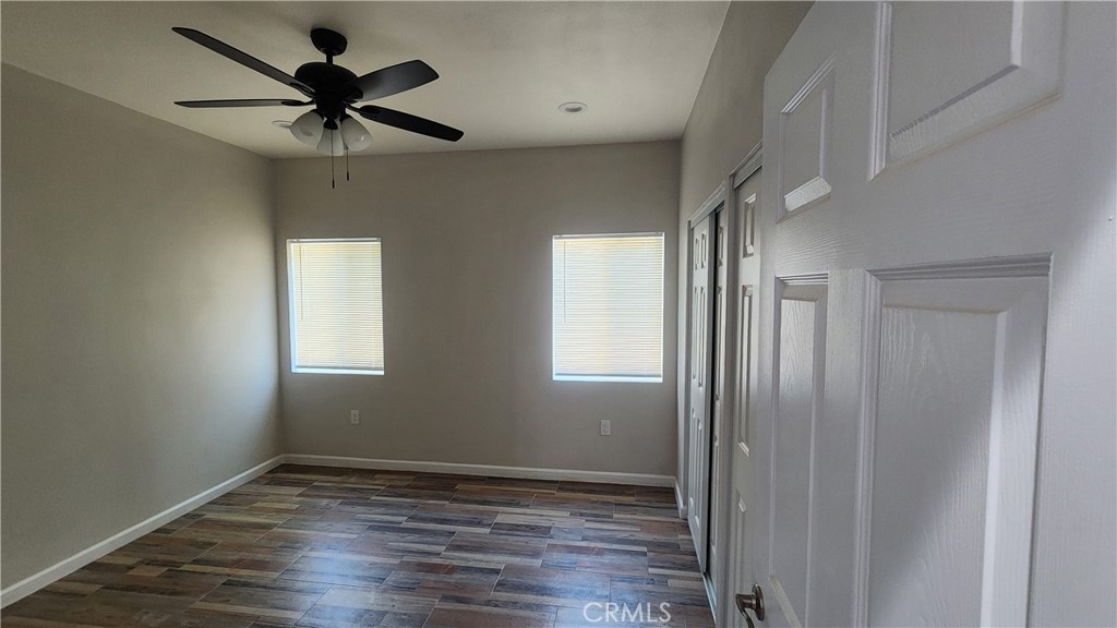 3433 Eucalyptus Avenue Riverside, CA 92507 - Photo 8 of 38 wooden floor in an empty room with a window