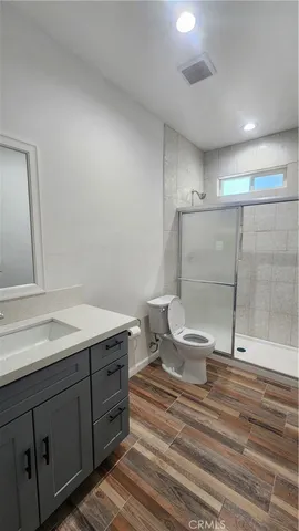 a spacious bathroom with a double vanity sink and a mirror
