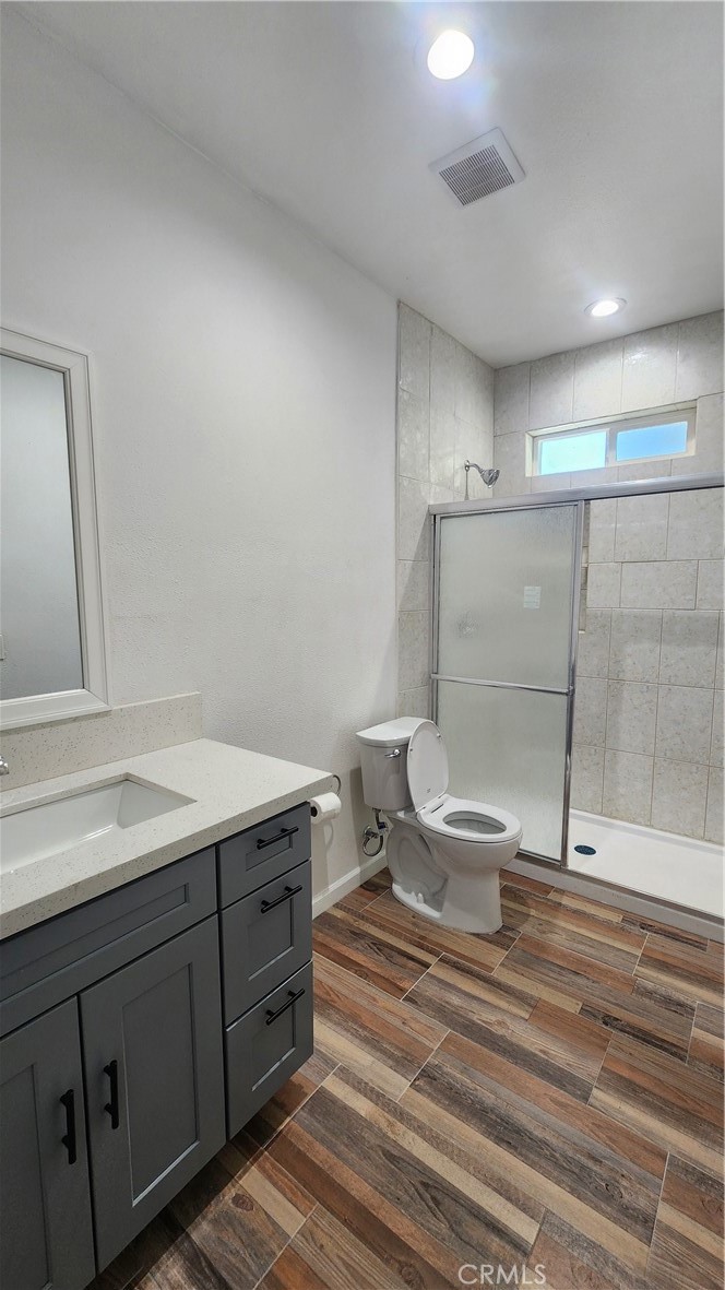 3433 Eucalyptus Avenue Riverside, CA 92507 - Photo 10 of 38 a bathroom with a sink toilet and vanity