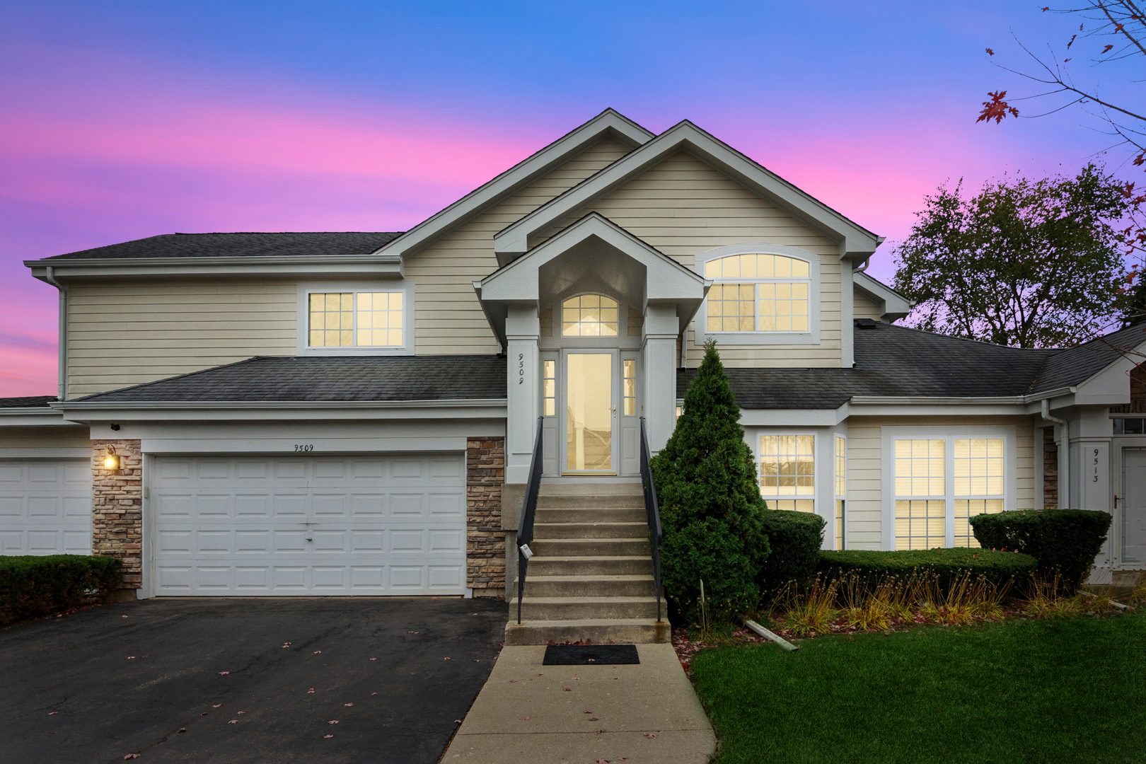 a front view of a house with a yard