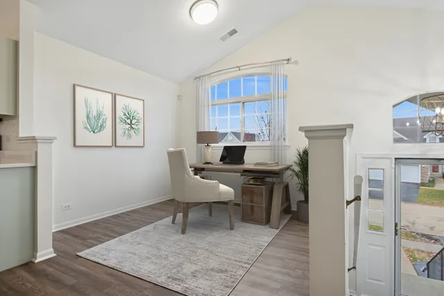 a workspace with furniture and window