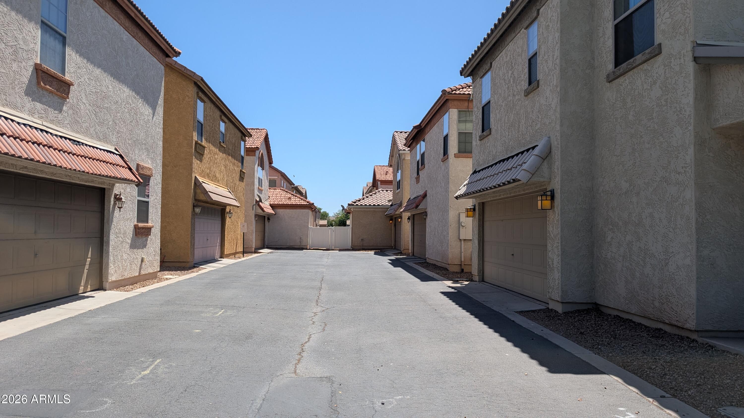1453 South Sinova Avenue Gilbert, AZ 85296 - Photo 43 of 46 a view of a street with buildings