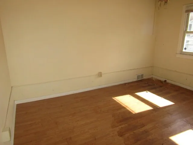 an empty room with a natural light