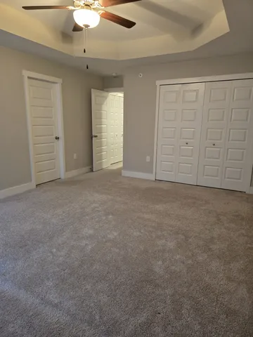 an empty room with closet area