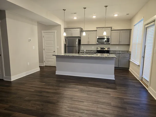 a view of kitchen with wooden floor