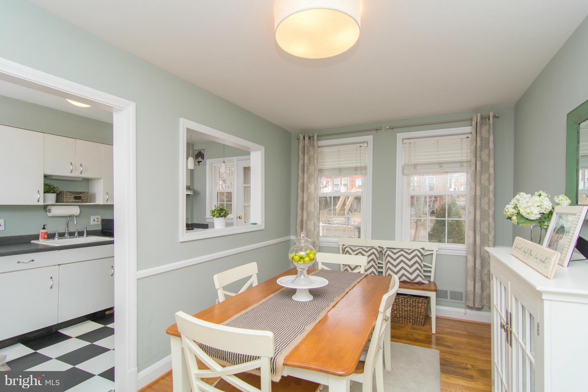 1642 Aberdeen Road Baltimore, MD 21286 - Photo 9 of 25 a view of a dining room with furniture and a potted plant