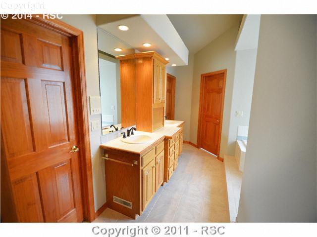 7270 Shoup Road Colorado Springs, CO 80908 - Photo 7 of 16 Elegant master bath has two walk-in closets, a steam shower and whirlpool bath.