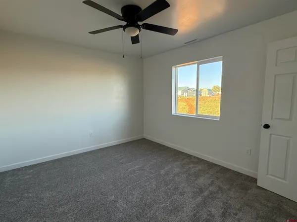 a view of a hallway with closet and entryway