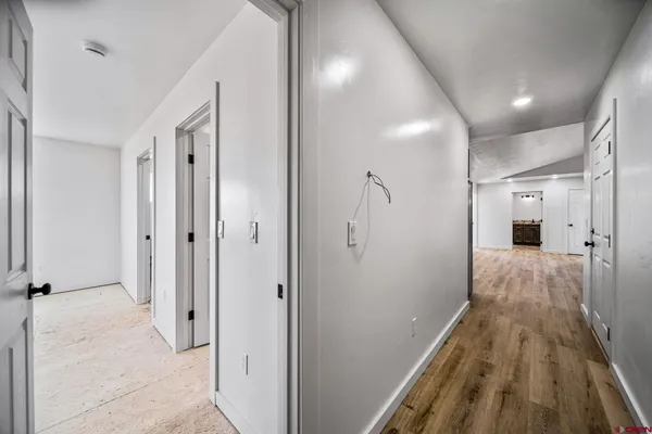 a bathroom with a granite countertop sink a toilet and bathtub