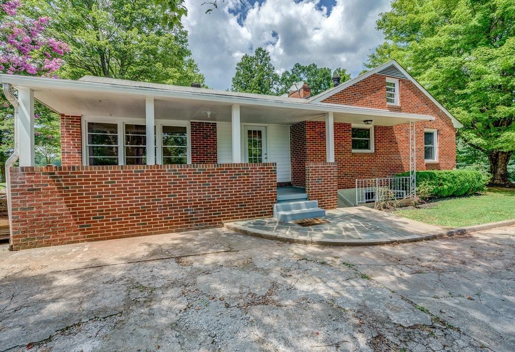 11885 Hardy Road Hardy, VA 24101 - Photo 5 of 48 a front view of a house with a garden