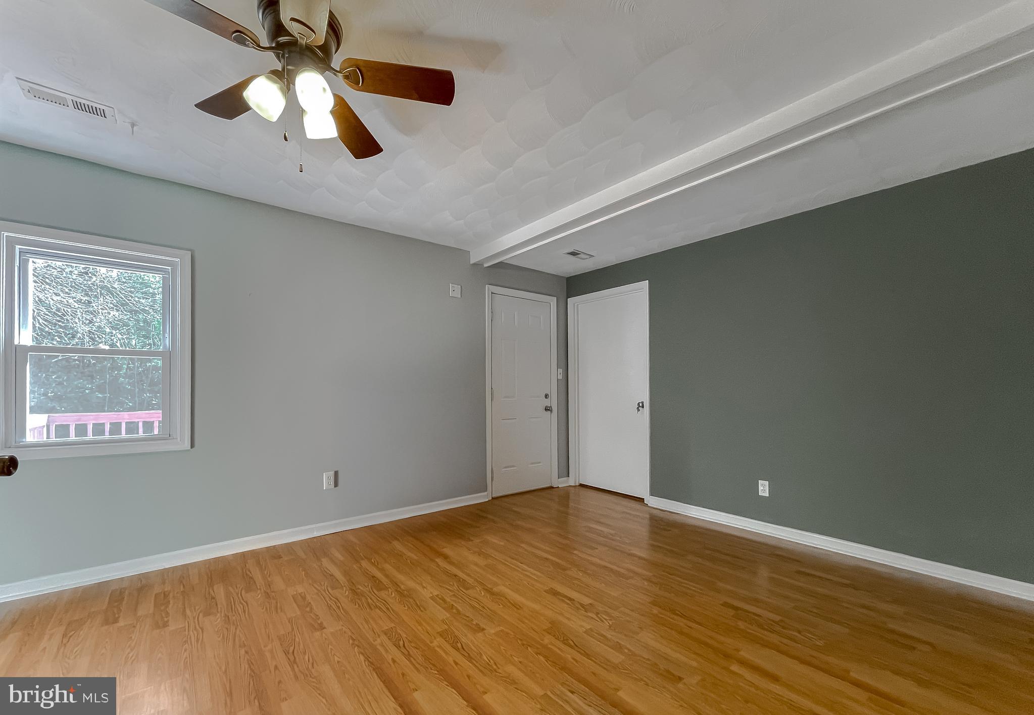25102 Three Notch Road Hollywood, MD 20636 - Photo 44 of 57 Bedroom #3, exit to rear of home, and closet view