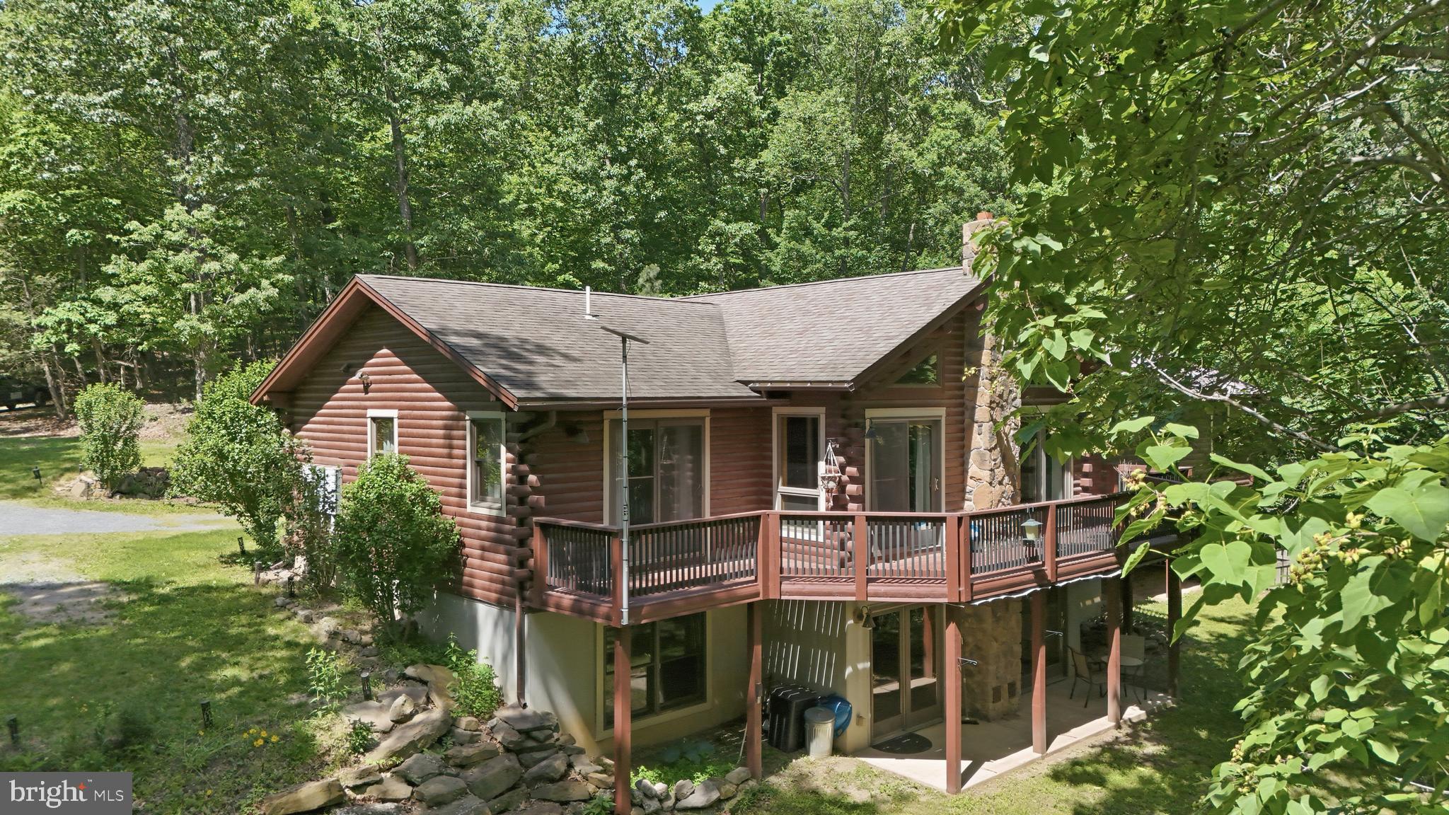 1400 Core Road Romney, WV 26757 - Photo 62 of 73 a view of a house with backyard porch and sitting area