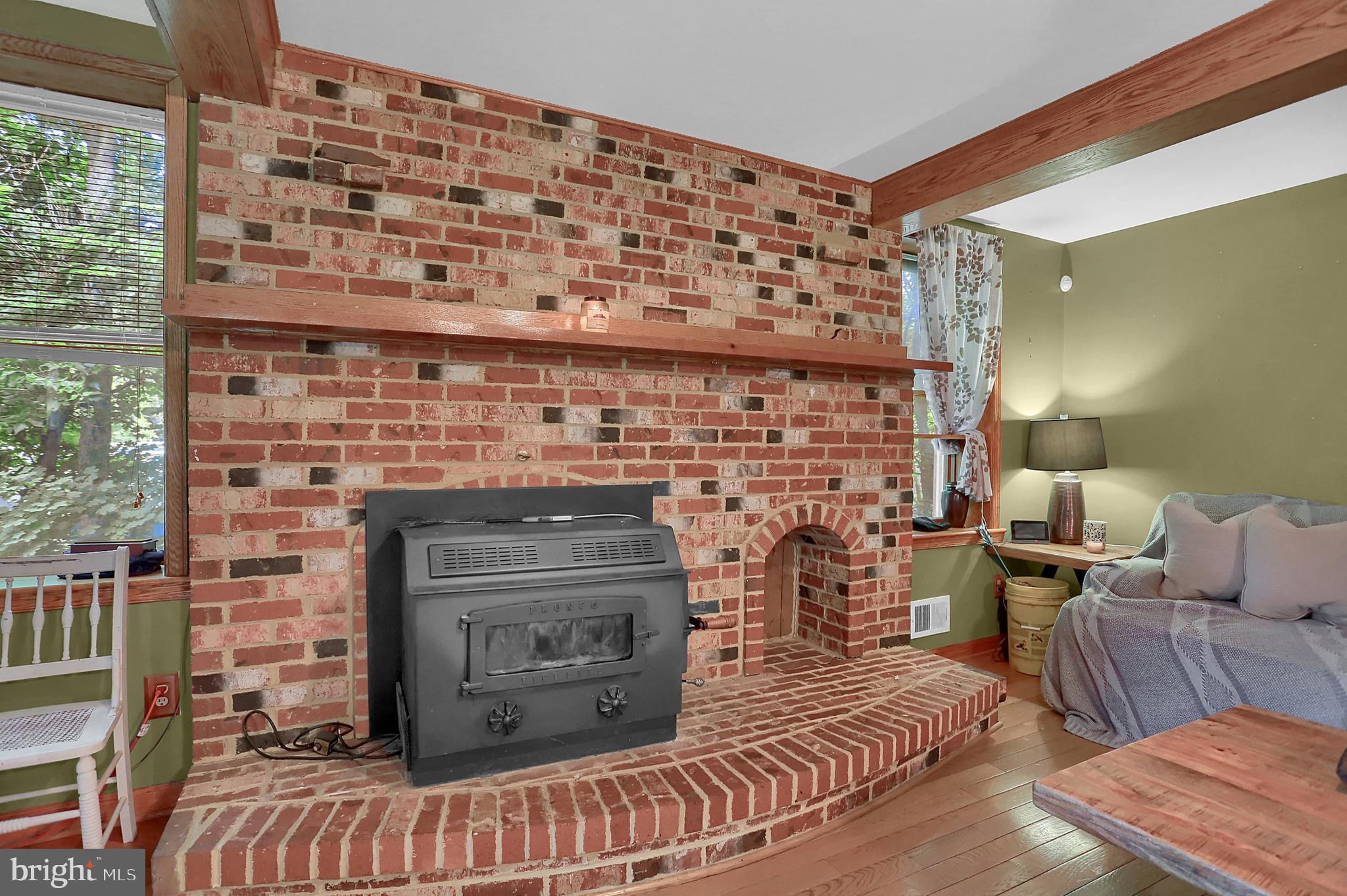 11026 Welsh Run Road Greencastle, PA 17225 - Photo 23 of 59 Beautiful brick fireplace and woodstove insert