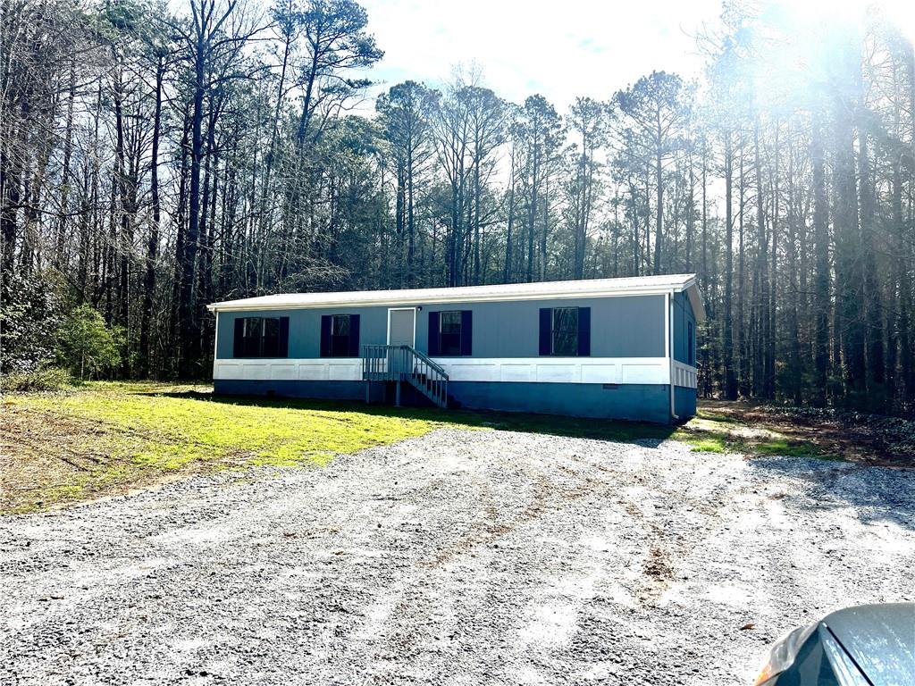 886 Walnut Drive Monroe, GA 30655 - Photo 1 of 1 a view of a house with a yard