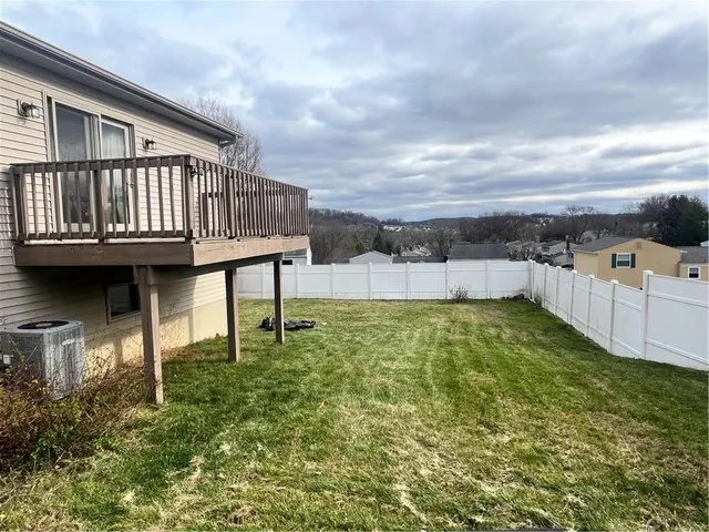 a view of a garden with lawn chairs