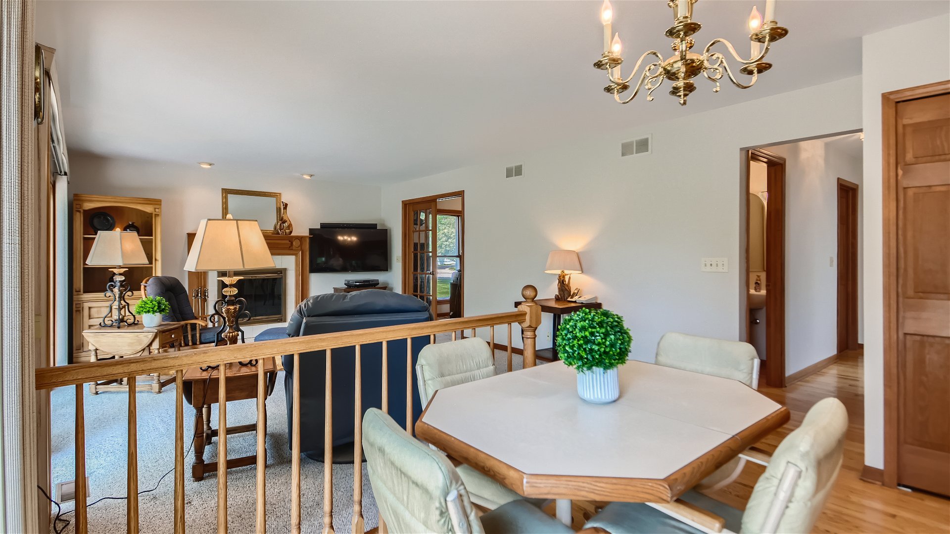 1840 Nicholson Drive Hoffman Estates, IL 60192 - Photo 11 of 28 a view of a dining room with furniture a chandelier and wooden floor
