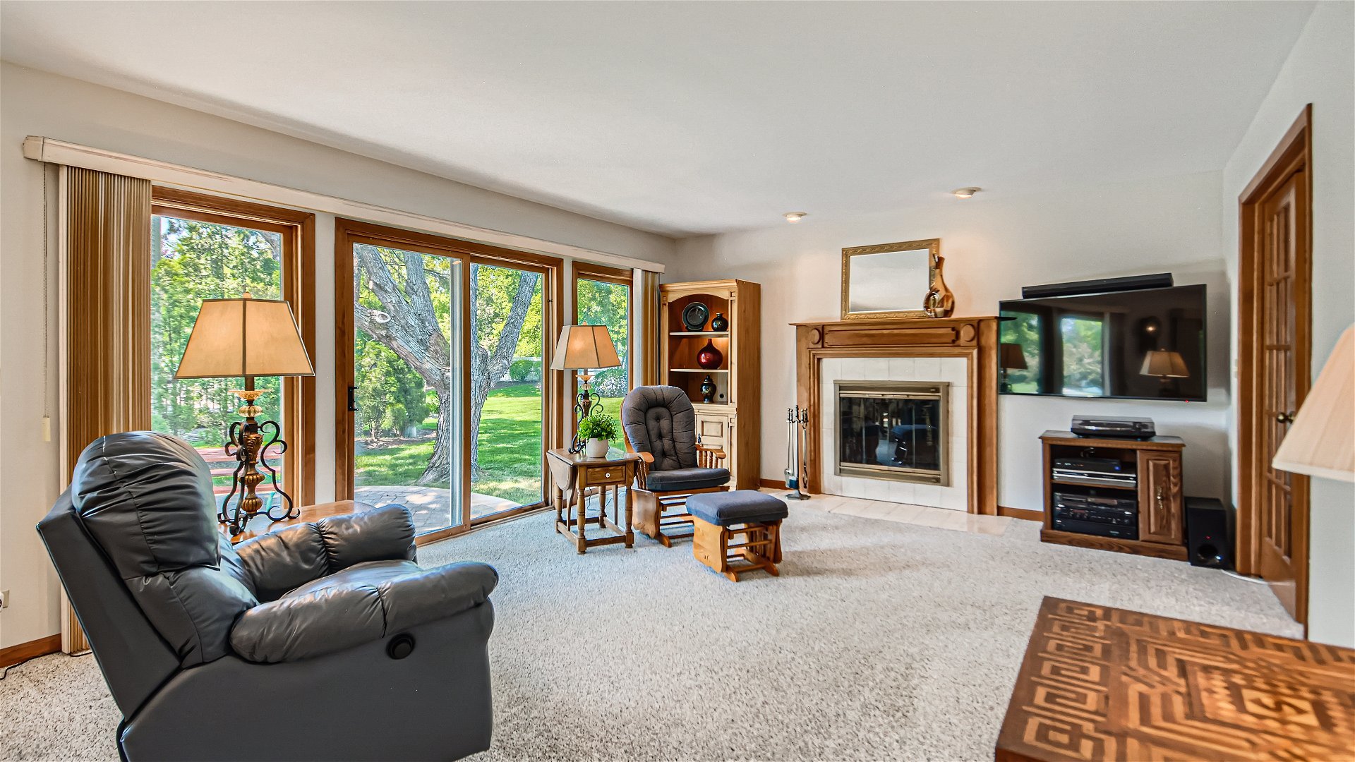 1840 Nicholson Drive Hoffman Estates, IL 60192 - Photo 12 of 28 a living room with furniture large window and a flat screen tv