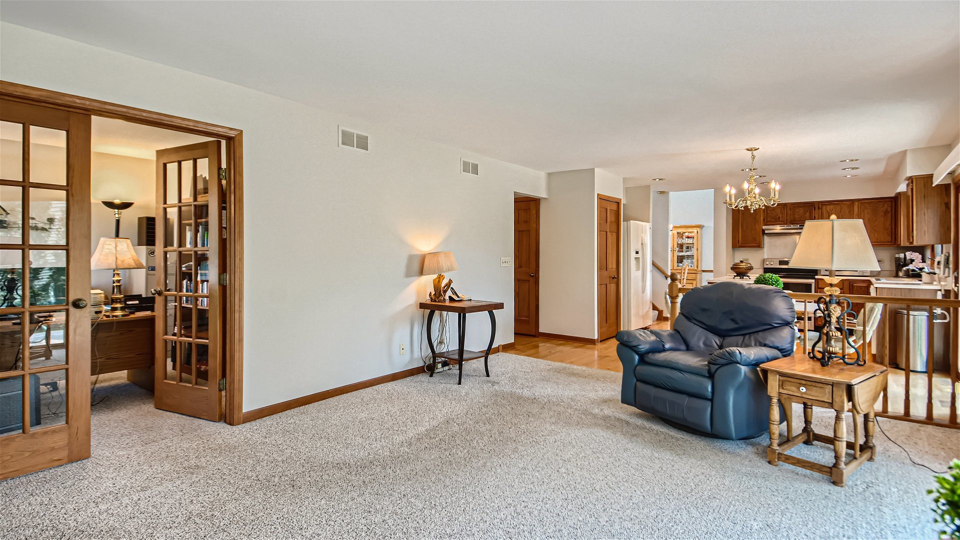 1840 Nicholson Drive Hoffman Estates, IL 60192 - Photo 13 of 28 a living room with furniture and a flat screen tv