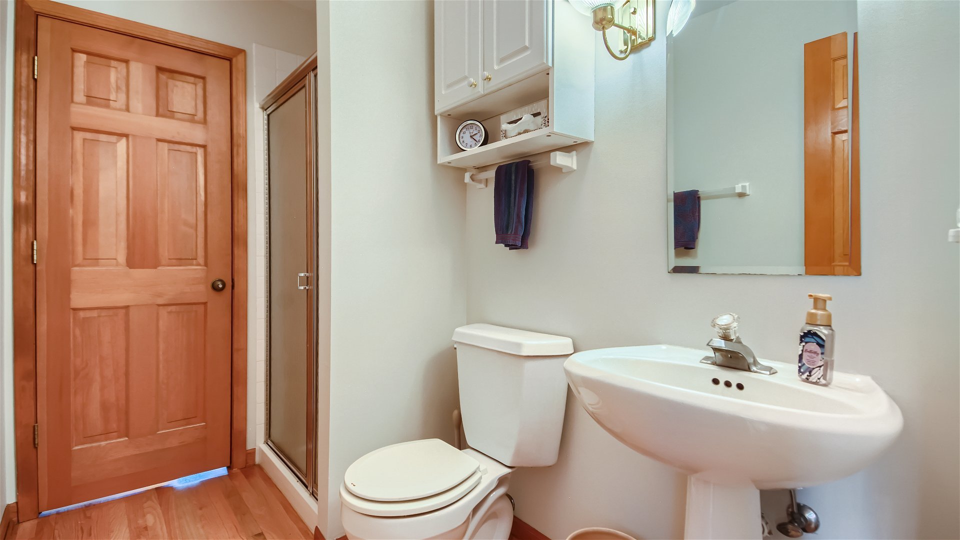 1840 Nicholson Drive Hoffman Estates, IL 60192 - Photo 14 of 28 a white toilet sitting next to a bathroom sink