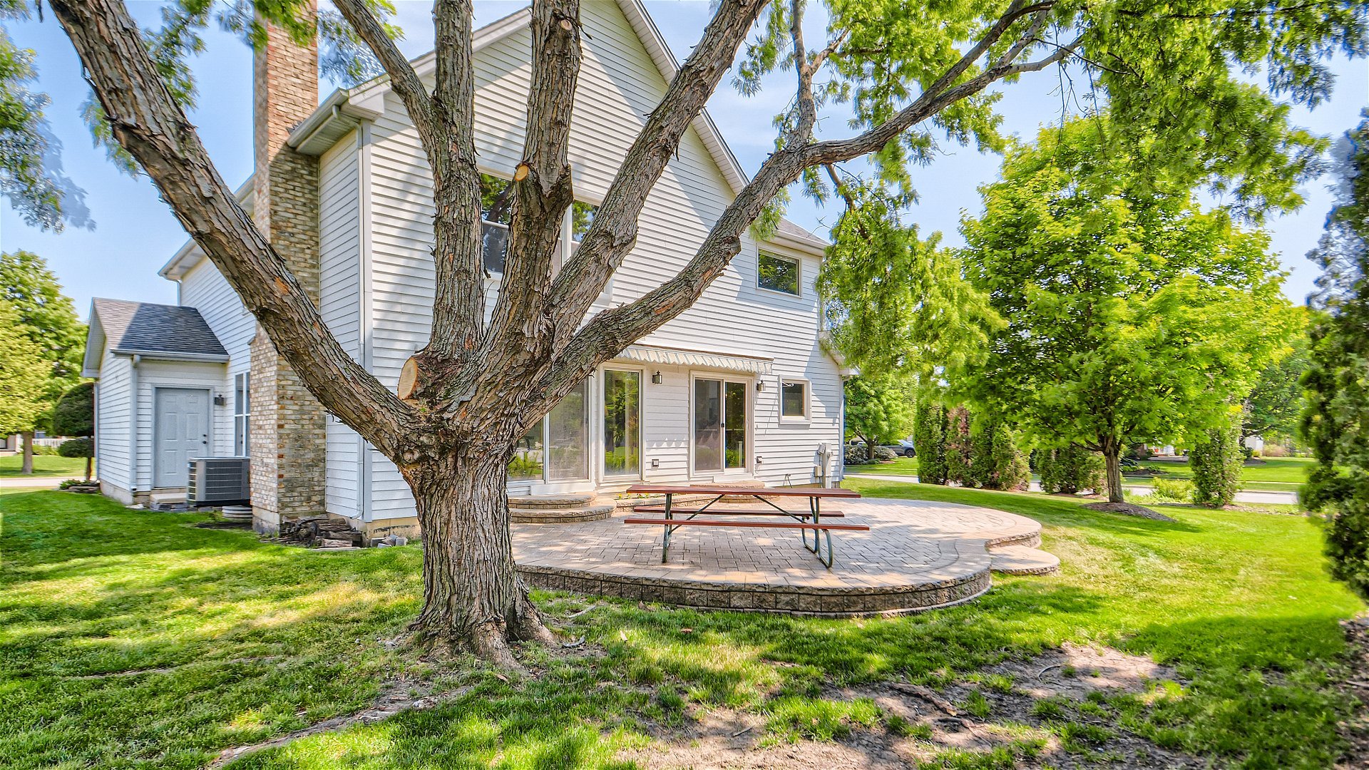 1840 Nicholson Drive Hoffman Estates, IL 60192 - Photo 27 of 28 a house with garden in front of it