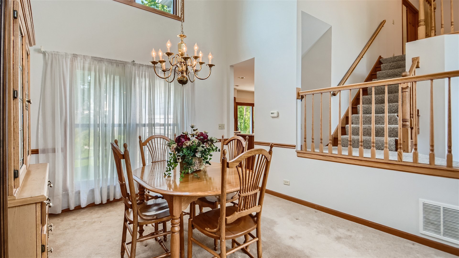 1840 Nicholson Drive Hoffman Estates, IL 60192 - Photo 5 of 28 a view of a dining room with furniture and chandelier