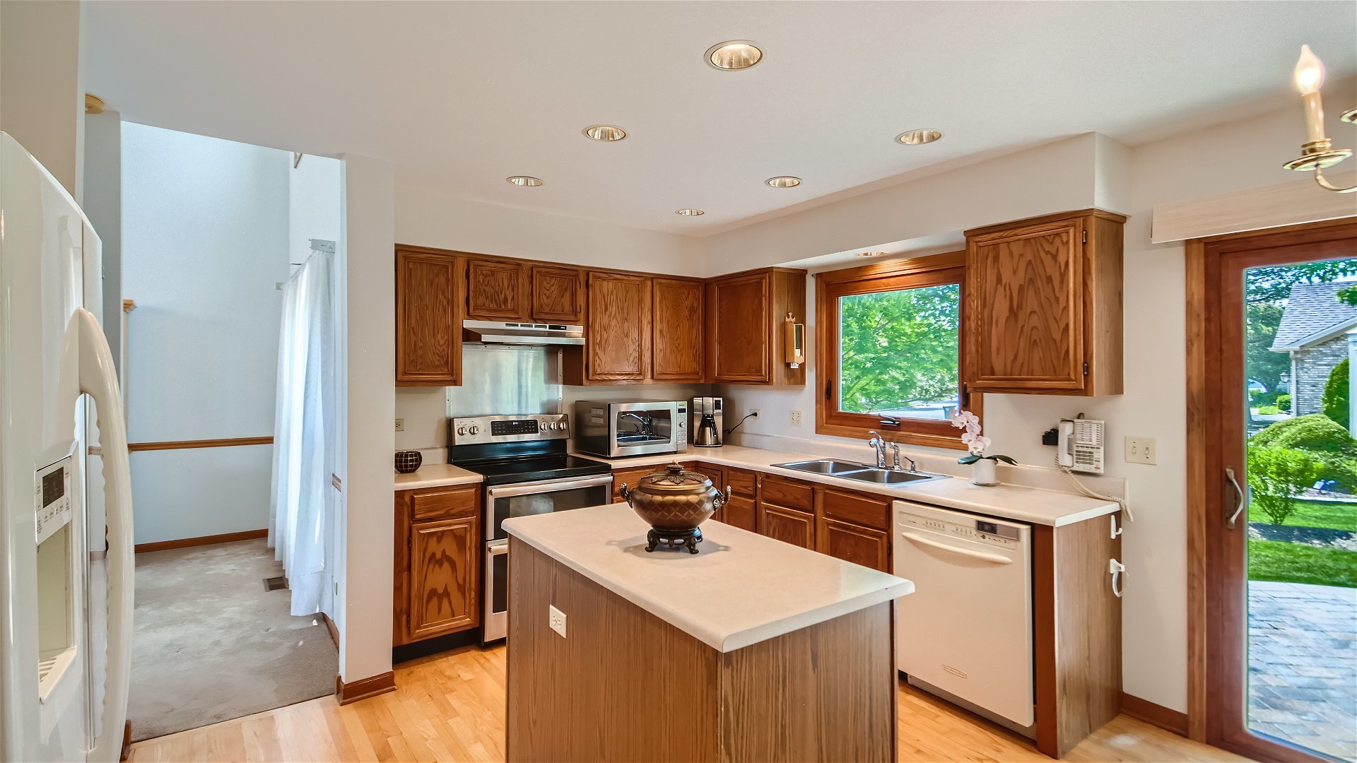 1840 Nicholson Drive Hoffman Estates, IL 60192 - Photo 9 of 28 a kitchen with a sink stove top oven and refrigerator
