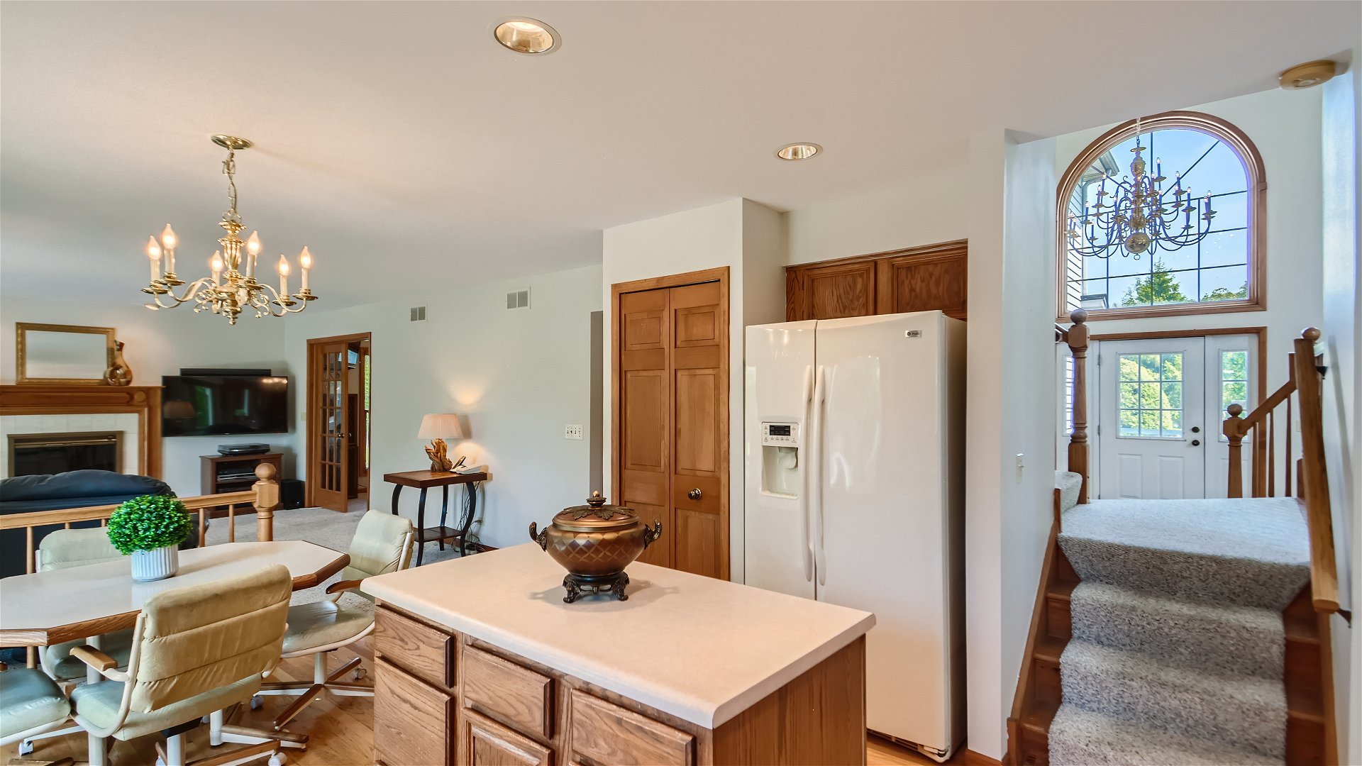 1840 Nicholson Drive Hoffman Estates, IL 60192 - Photo 10 of 28 a view of a dining room with furniture a chandelier and wooden floor