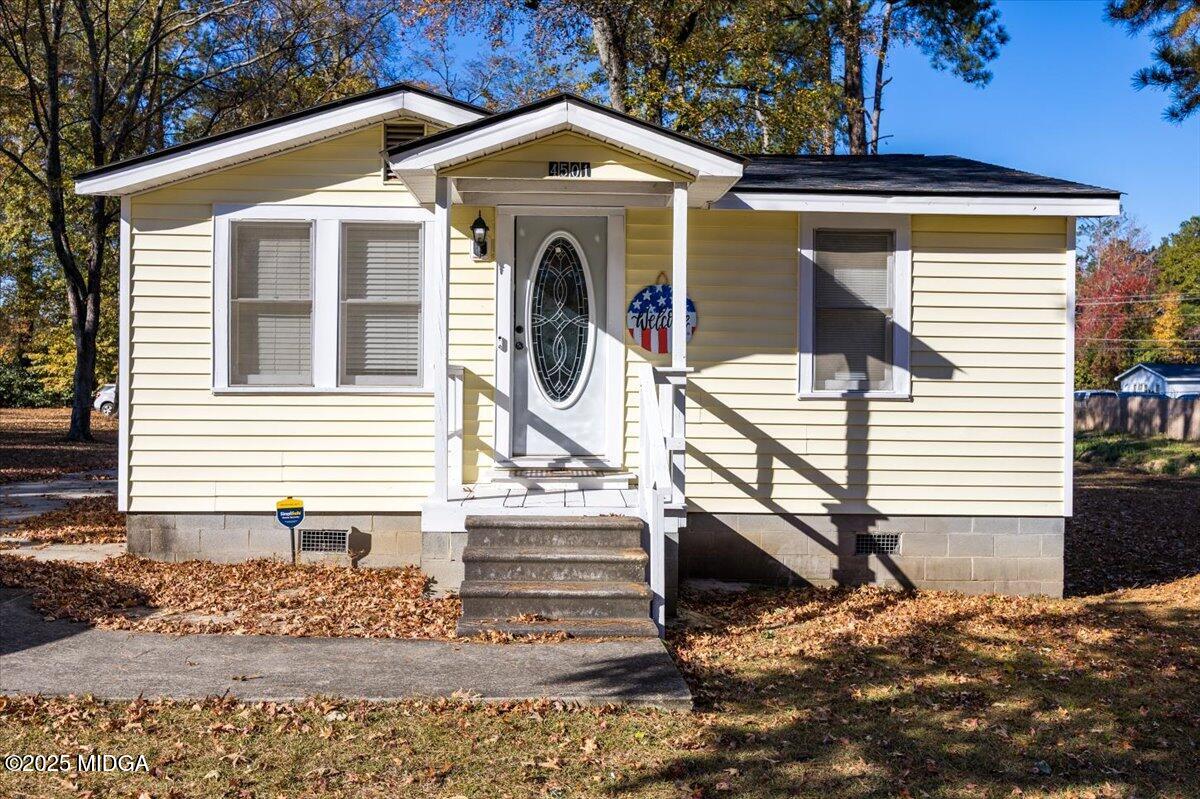 4501 Massey Road Macon, GA 31206 - Photo 2 of 11 a view of a house with a small yard and large tree