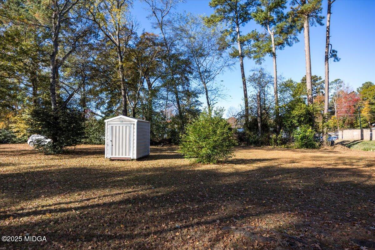 4501 Massey Road Macon, GA 31206 - Photo 8 of 11 a view of a road with a house and large trees