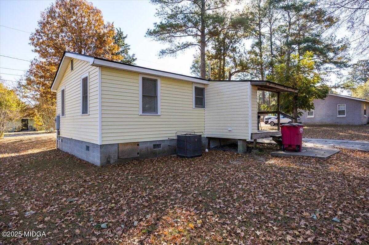 4501 Massey Road Macon, GA 31206 - Photo 9 of 11 a view of a small house with yard and a tree
