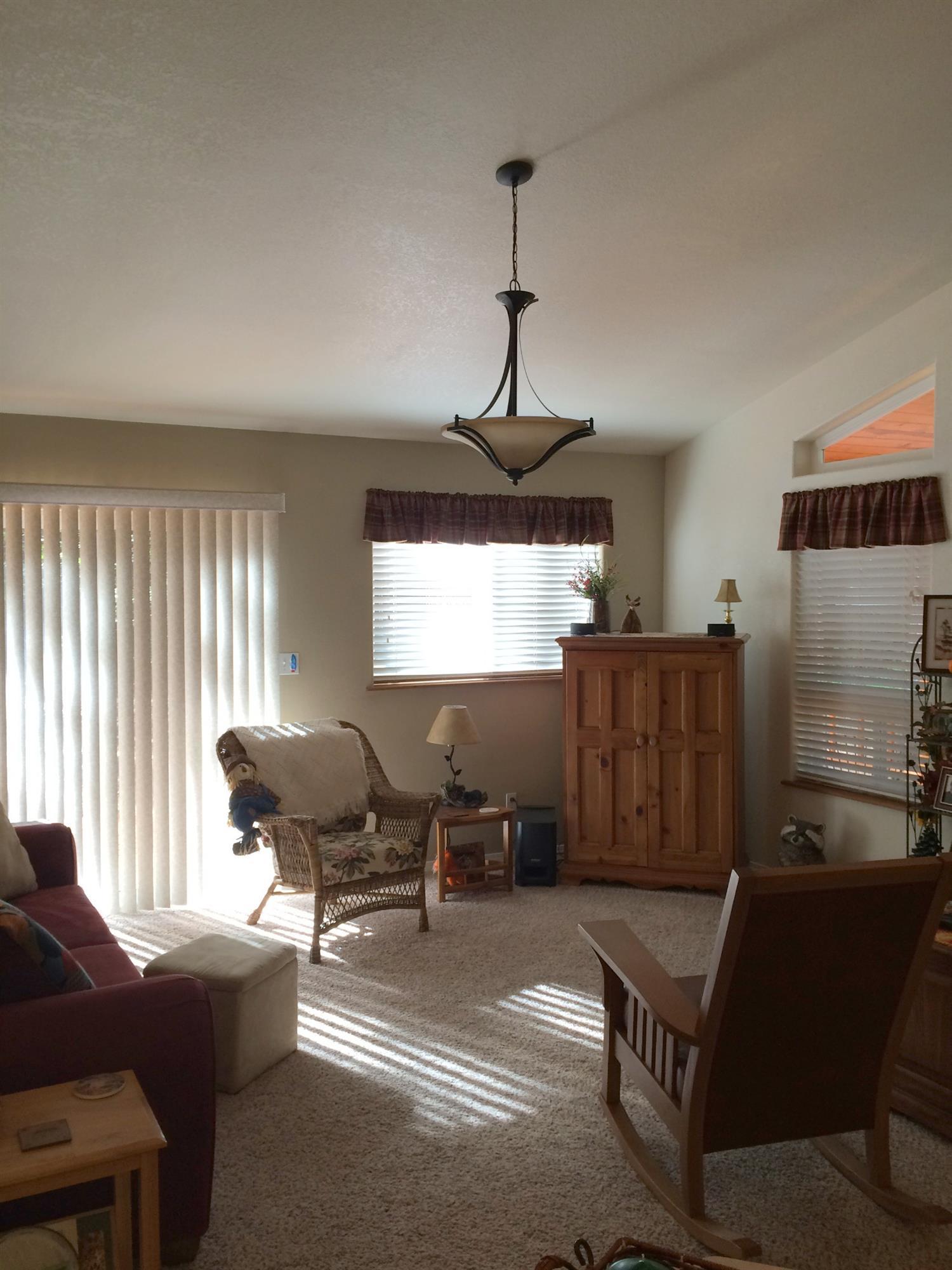 435 South Old Stage Road Cave Junction, OR 97523 - Photo 7 of 22 Living room area, opposite the dining ar