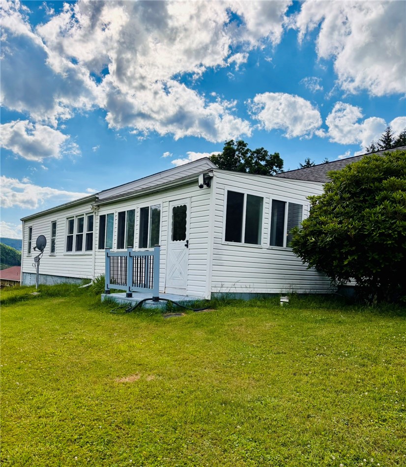 36 Walsh Road Southport, NY 14894 - Photo 6 of 36 Side view (sun room)
