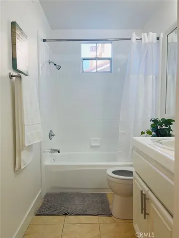 a bathroom with a bathtub a toilet and a shower