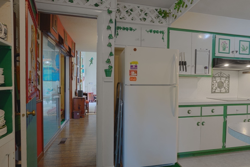 17 Juniper Lane Amherst, MA 01002 - Photo 18 of 42 a white refrigerator freezer sitting inside of a kitchen