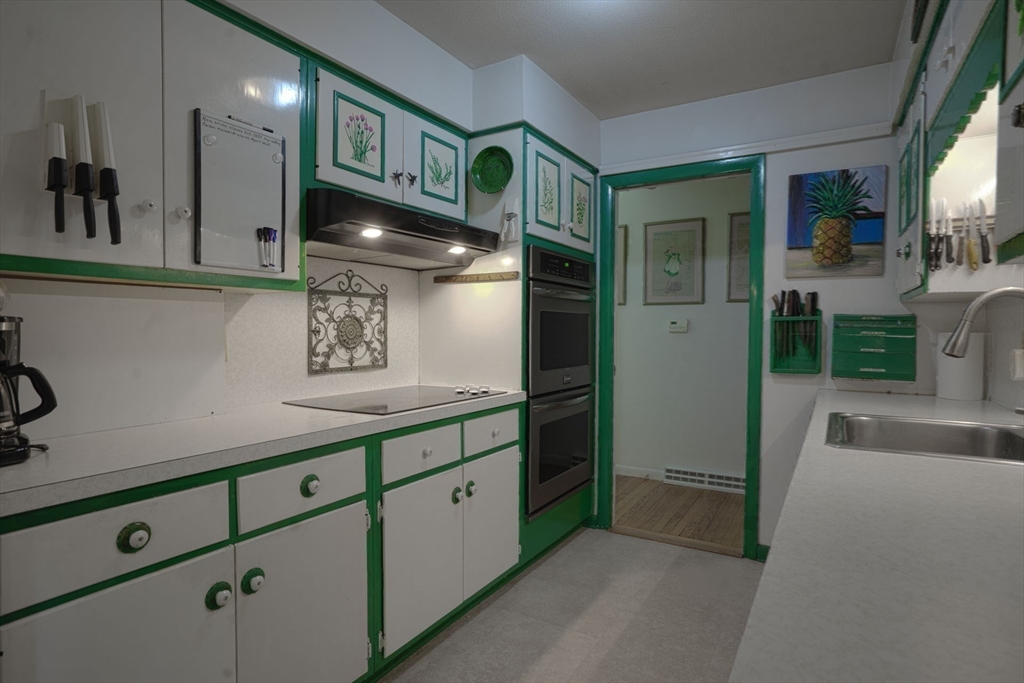 17 Juniper Lane Amherst, MA 01002 - Photo 19 of 42 a kitchen with stainless steel appliances a refrigerator and a sink