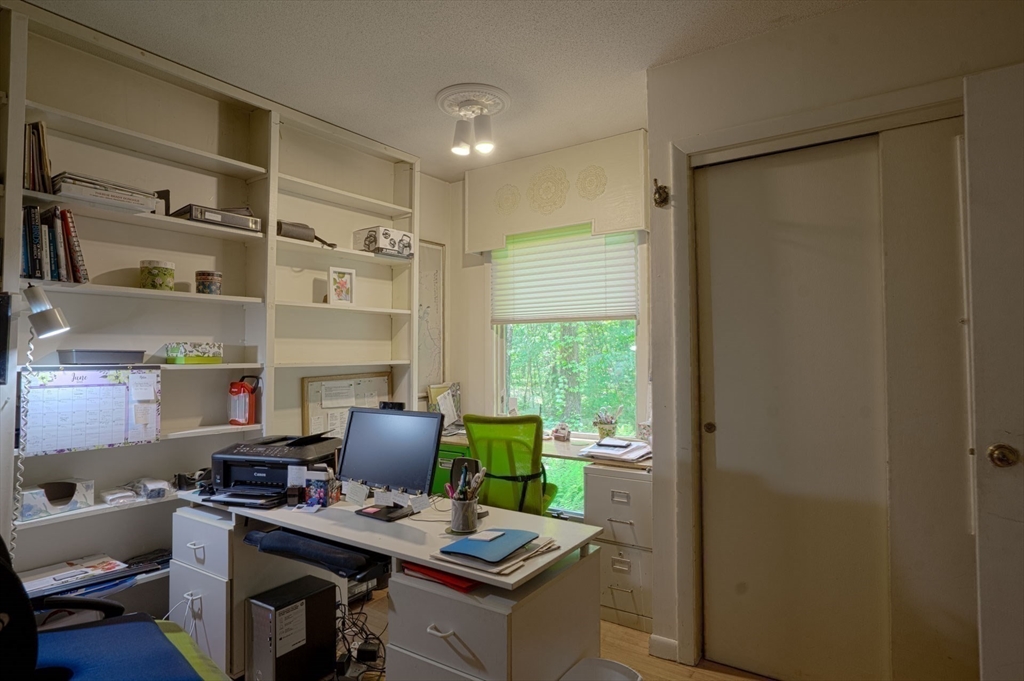 17 Juniper Lane Amherst, MA 01002 - Photo 23 of 42 a work room with furniture and a window