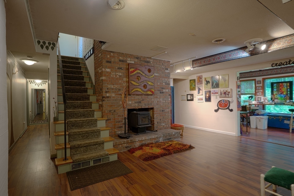17 Juniper Lane Amherst, MA 01002 - Photo 29 of 42 a living room with furniture and a fireplace