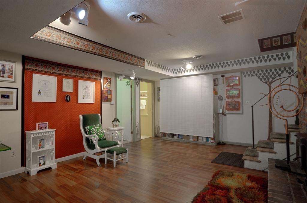 17 Juniper Lane Amherst, MA 01002 - Photo 30 of 42 a very nice looking room with many windows and furniture