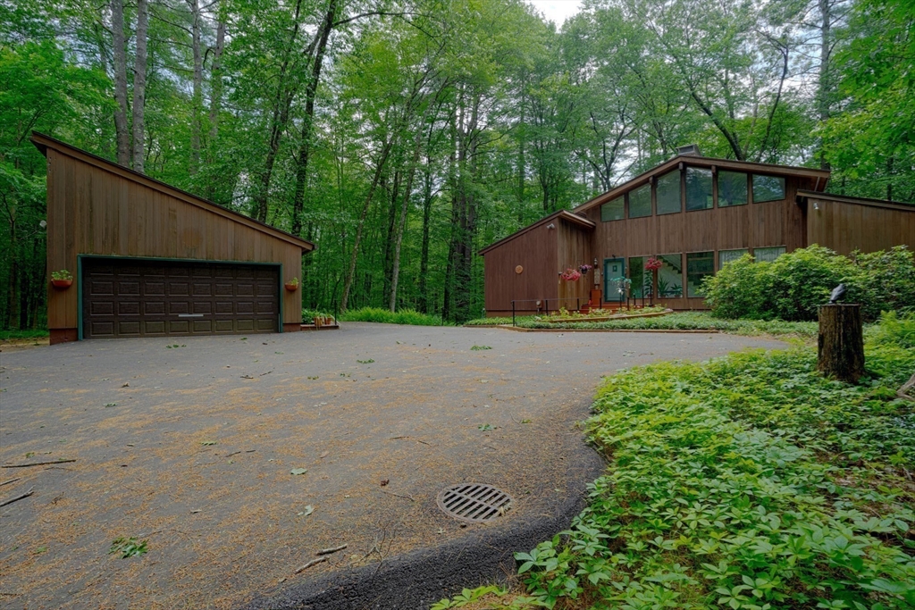 17 Juniper Lane Amherst, MA 01002 - Photo 3 of 42 a backyard of a house with lots of green space