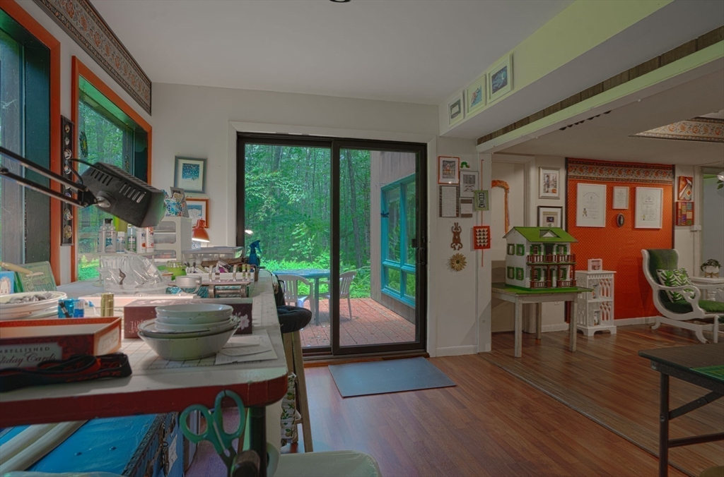 17 Juniper Lane Amherst, MA 01002 - Photo 31 of 42 a living room with furniture fireplace and a large window