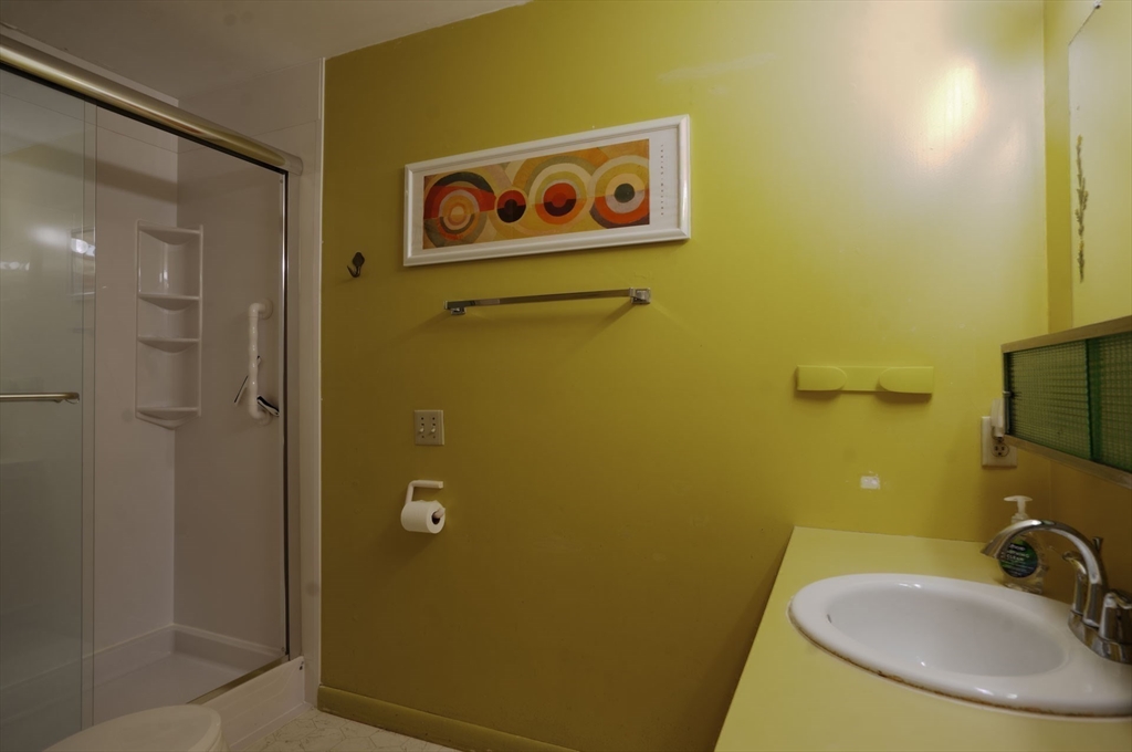 17 Juniper Lane Amherst, MA 01002 - Photo 35 of 42 a bathroom with a sink and a mirror