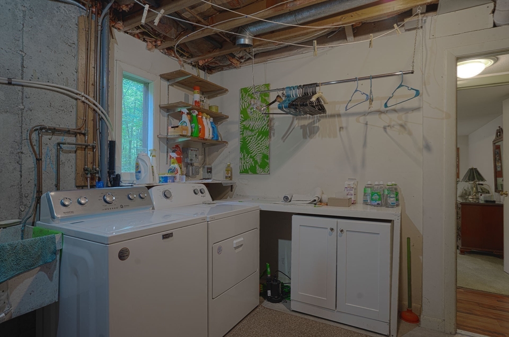 17 Juniper Lane Amherst, MA 01002 - Photo 38 of 42 a utility room with cabinets and washer