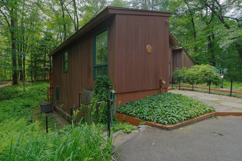 17 Juniper Lane Amherst, MA 01002 - Photo 41 of 42 a backyard of a house with lots of green space