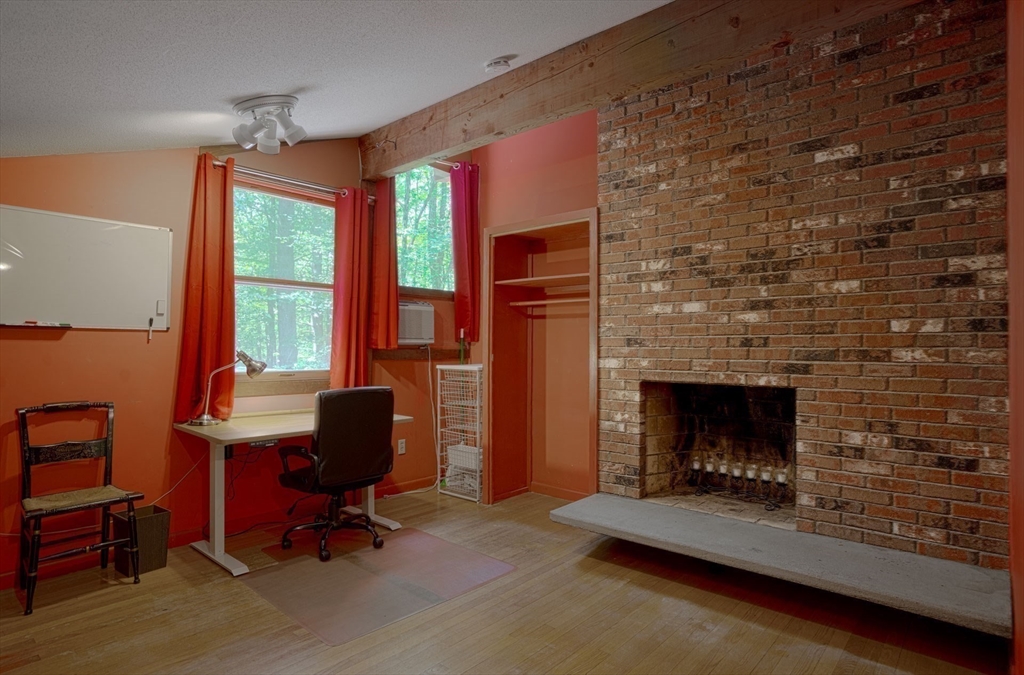 17 Juniper Lane Amherst, MA 01002 - Photo 8 of 42 a livingroom with fireplace and window