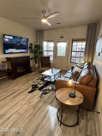 a bedroom with a bed a lamp and a chandelier