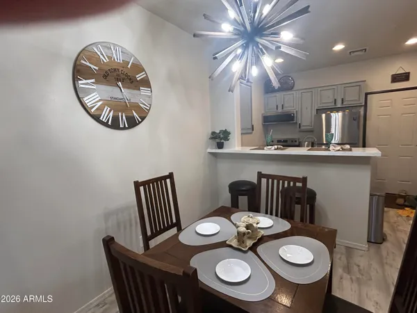 a bedroom with a bed and a lamp