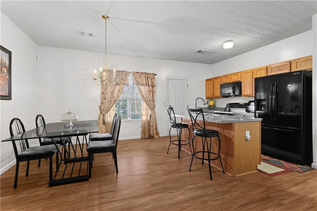 3000 Western Sunset Decatur, GA 30034 - Photo 12 of 37 a view of a dining room with furniture window and wooden floor