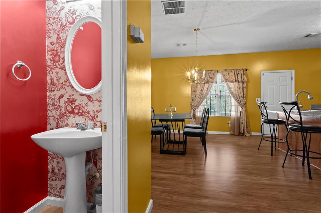 3000 Western Sunset Decatur, GA 30034 - Photo 19 of 37 a bathroom with a sink and mirror with bathtub